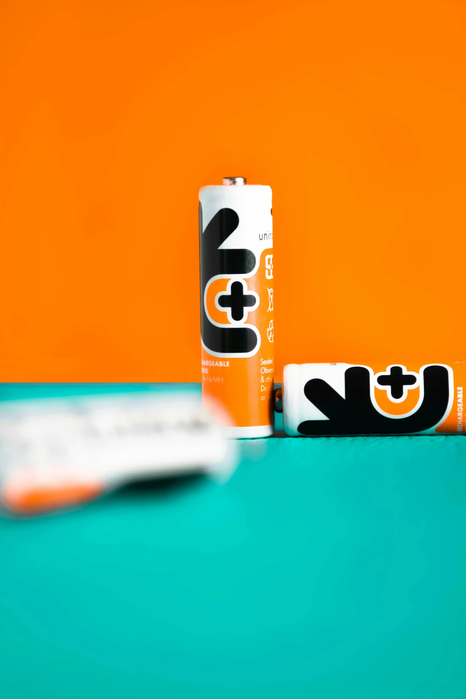 two batteries that are sitting on a table