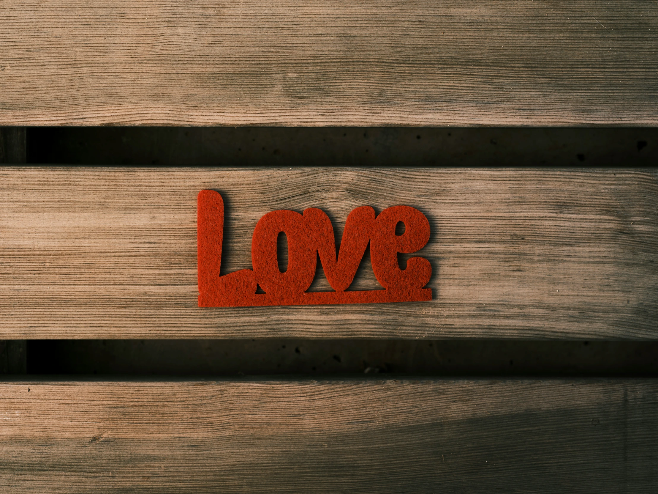 the word love is placed in the wood