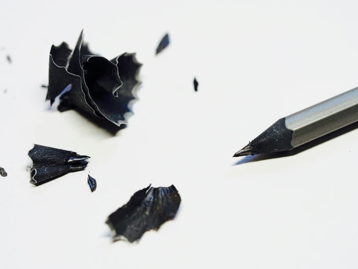 the sharp point is next to black shredded paper