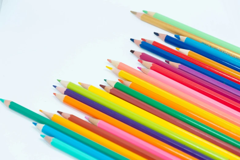 closeup of colored pencils lined up in order to show color