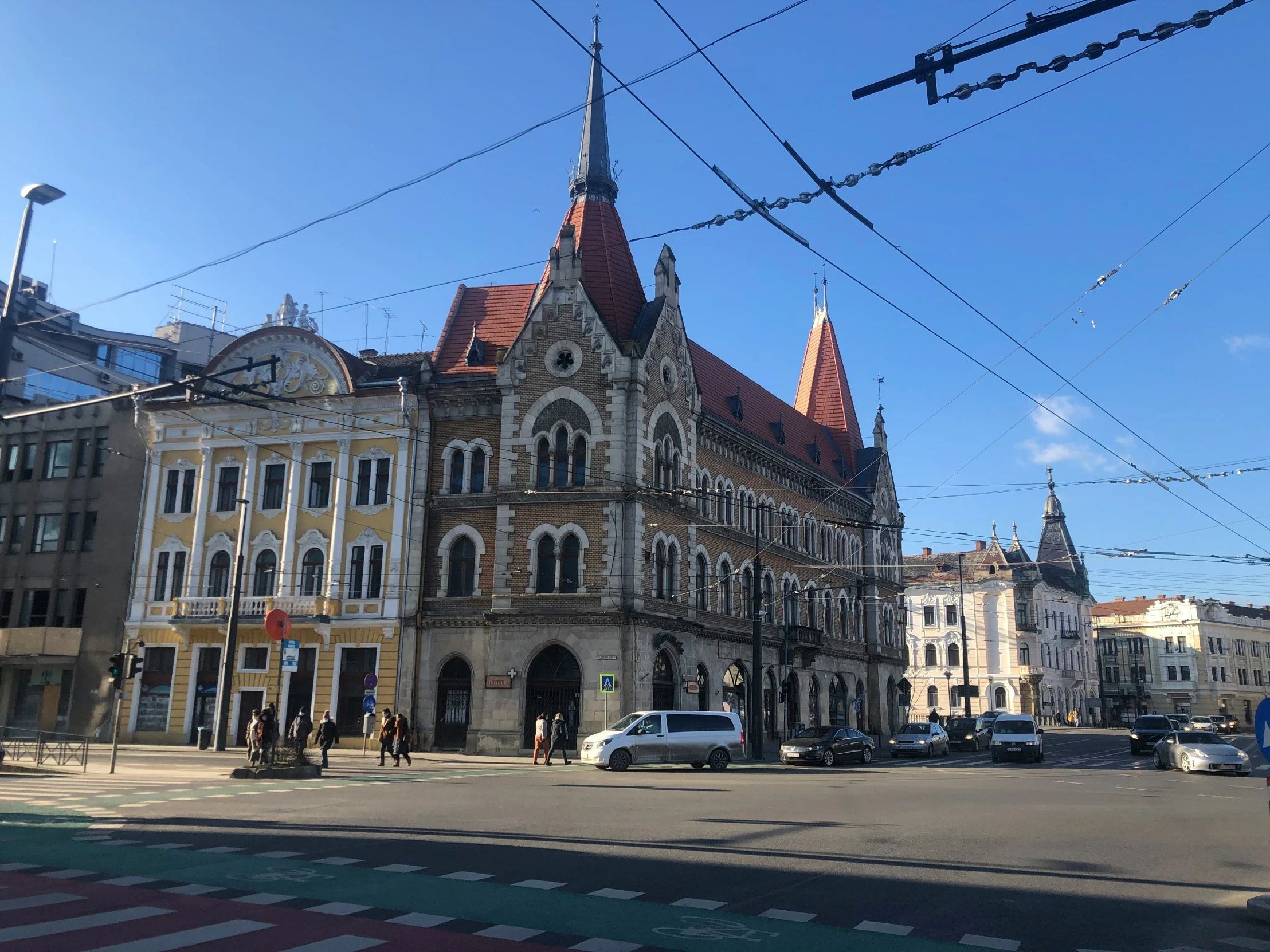 the ornate building is located on the corner of the street