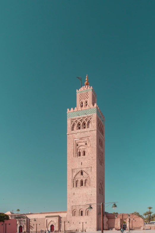 a tall tower with several windows next to a street