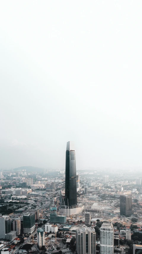 a large city filled with tall buildings and lots of green