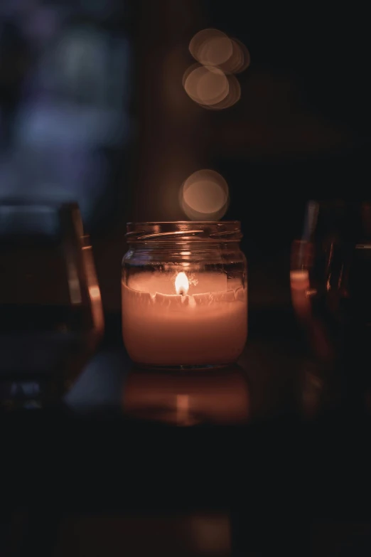 some candles and glasses on a table