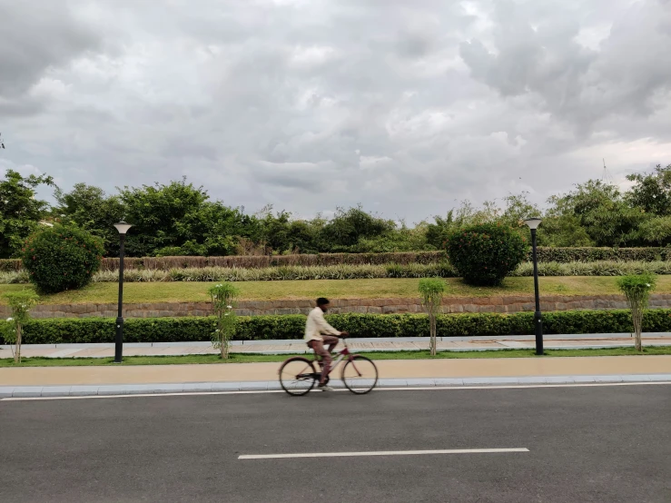 a woman riding her bike down the street