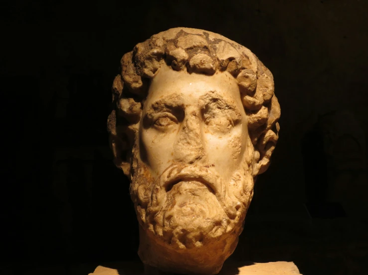 a sculpture of a bust of an ancient man