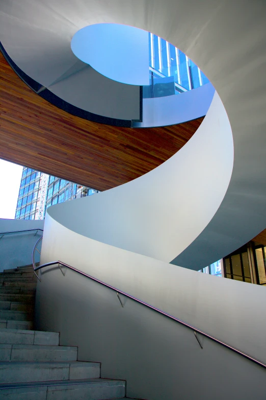 a stairway in front of a building with round windows