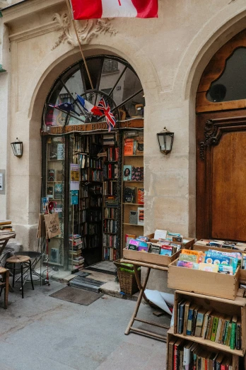 a bookshop with books on display and a flag