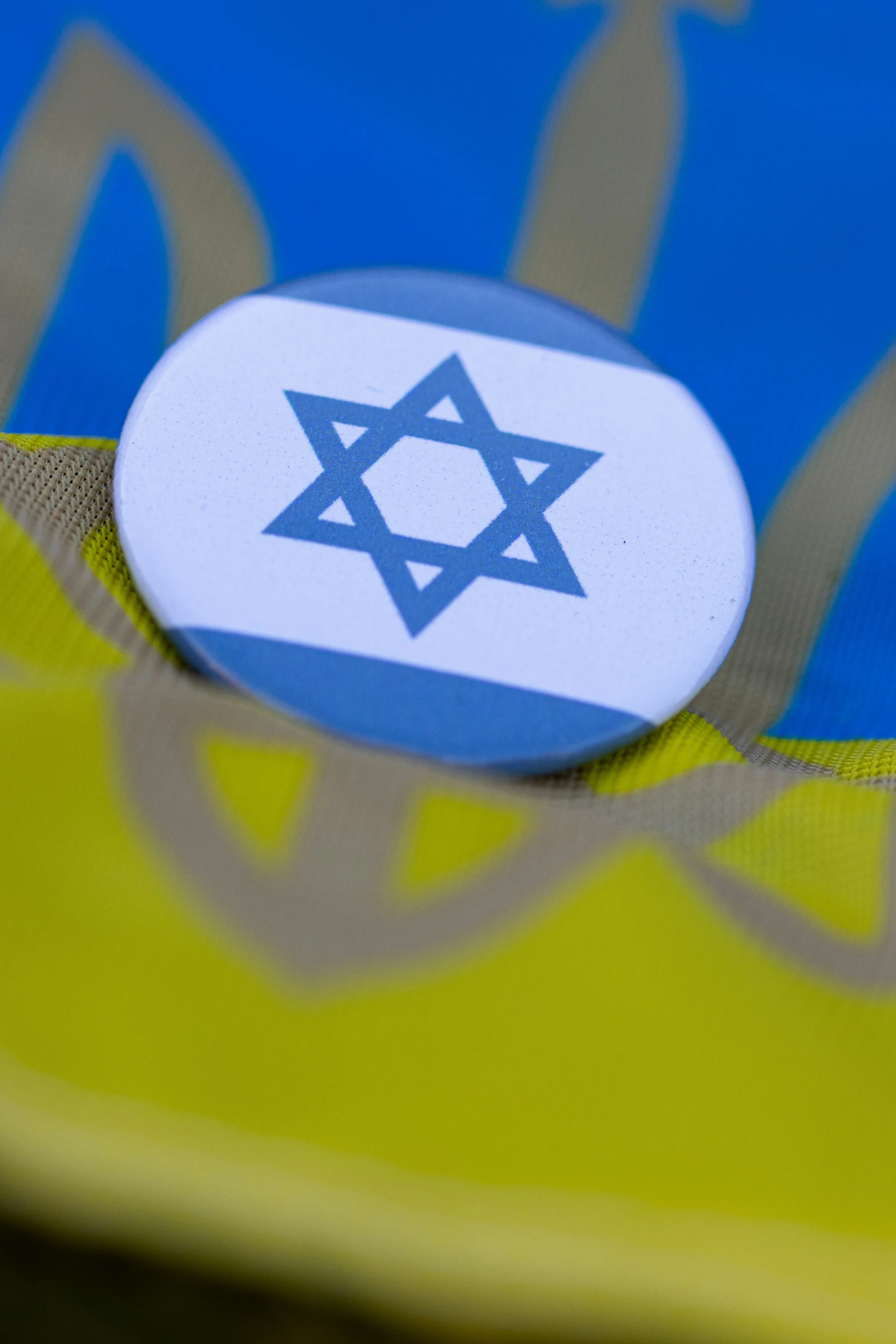 a blue and yellow object with a star of david on it