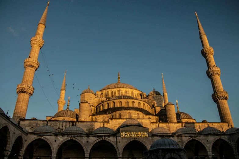 the side view of a large building with very tall spires