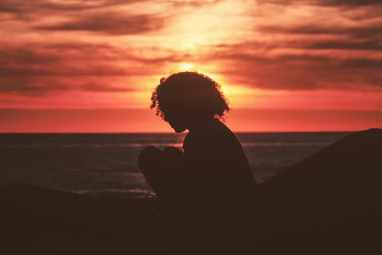 a person standing in front of the ocean