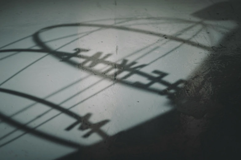 shadows on a wall cast by an airplane propeller