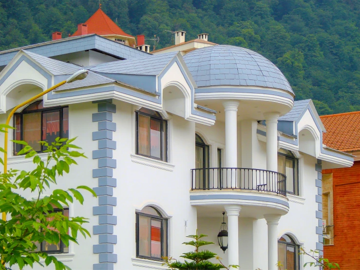 a blue and white house with lots of windows