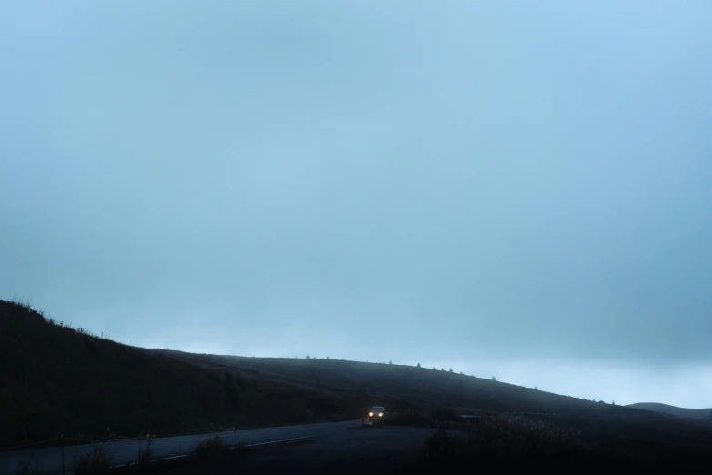 a truck is driving on a deserted road