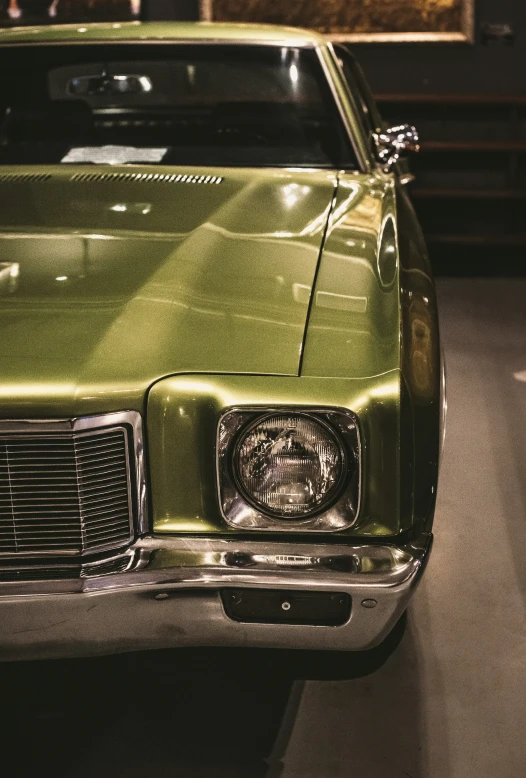 green car with the license plate on, parked outside