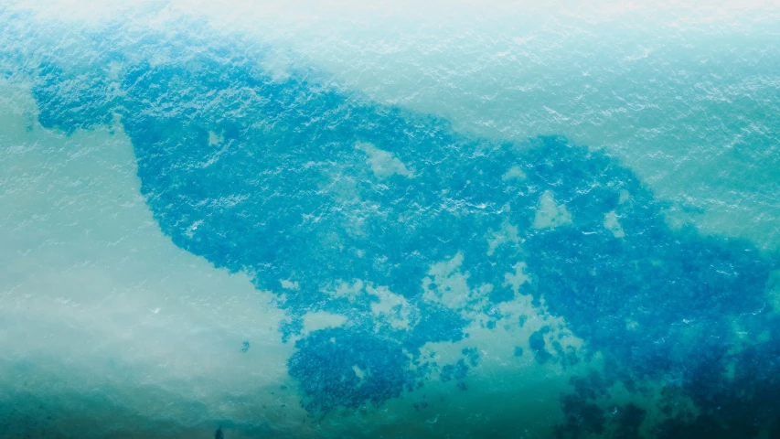 an artistic image of a man surfing the ocean