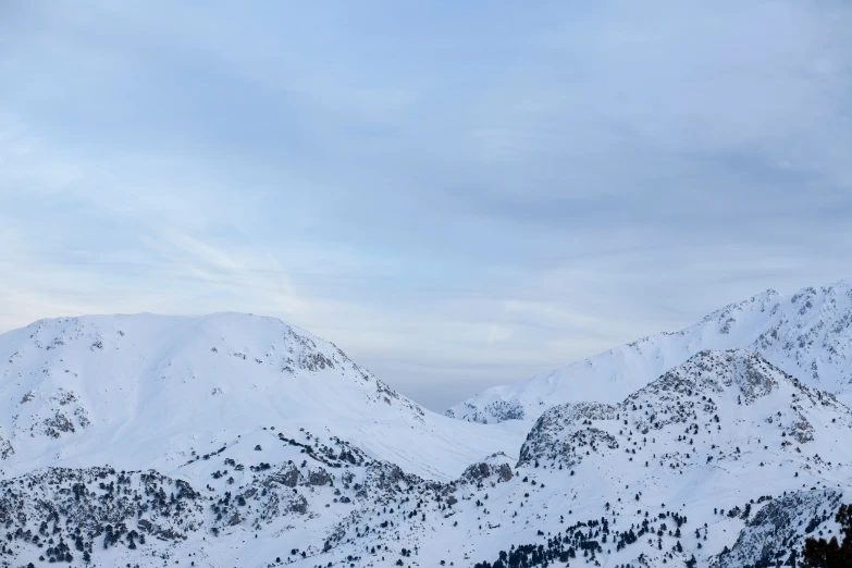 a couple of snowy mountains that are covered in snow