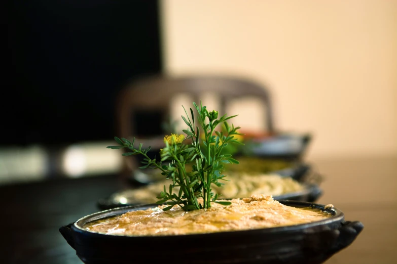 a bowl with some food in it is placed on a table