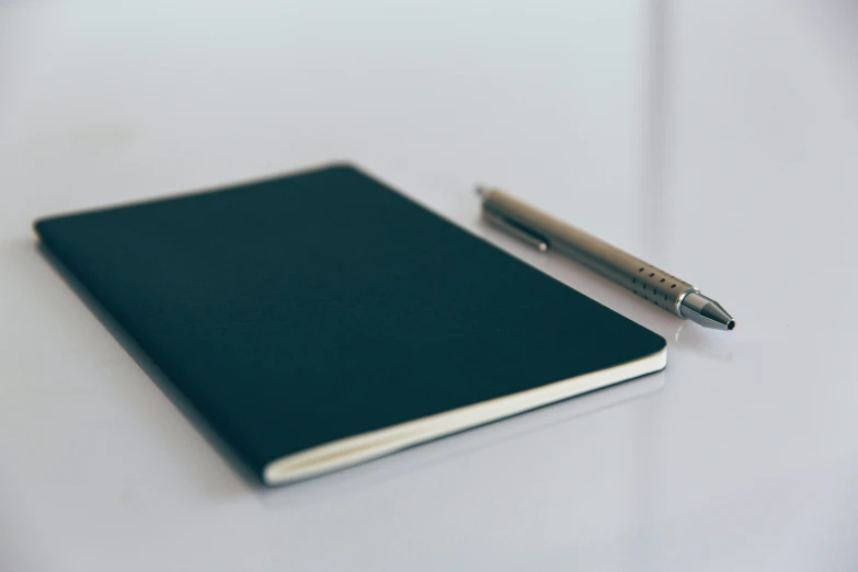 a pen is sitting on top of a book