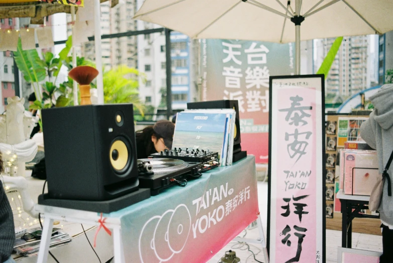 dj mixing on sound mixers at an outdoor event