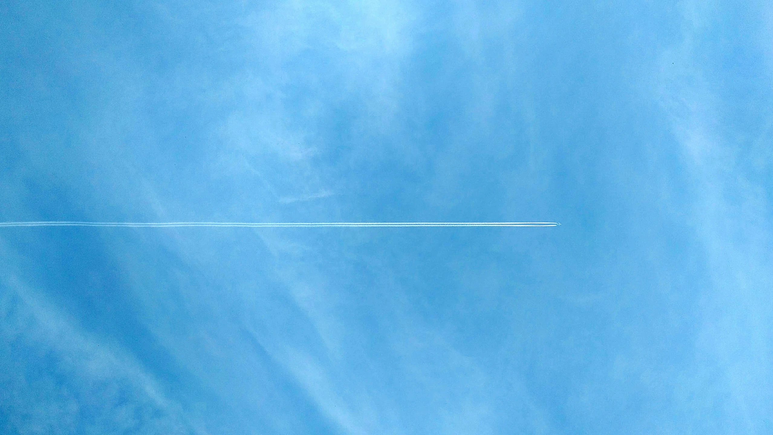 an airplane is flying in the sky