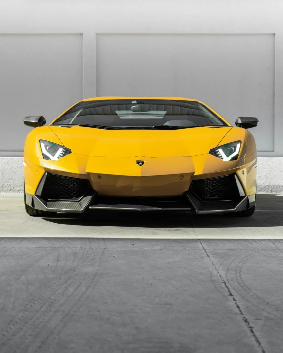 a very bright yellow sport car sits parked