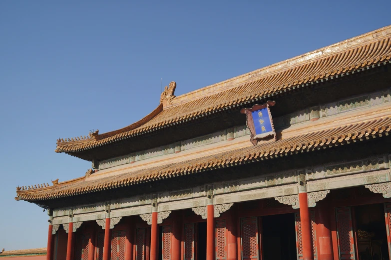 a chinese building has two stories with many pillars on each floor