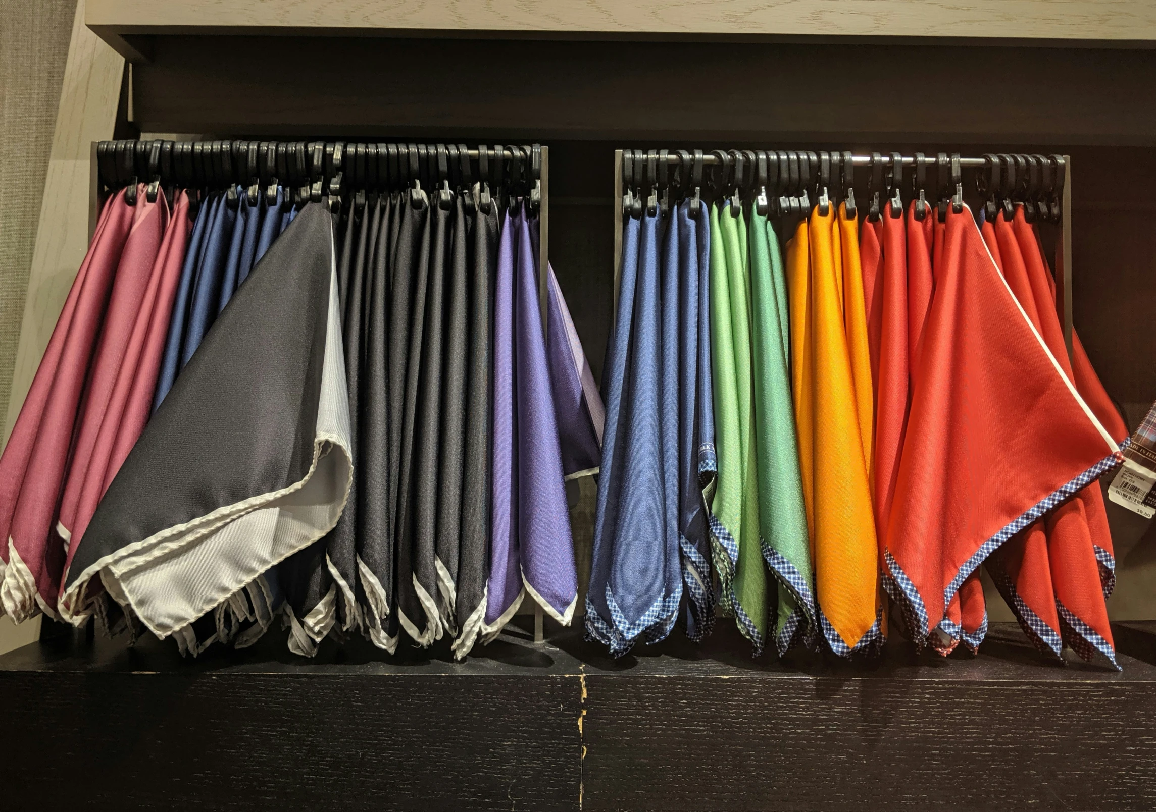 towels are lined up in an organized closet