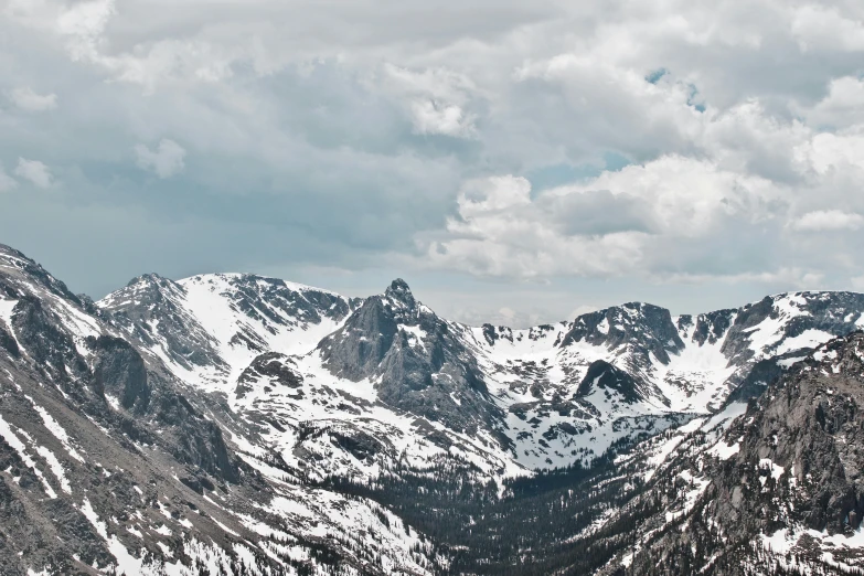 a very large mountain range covered in snow