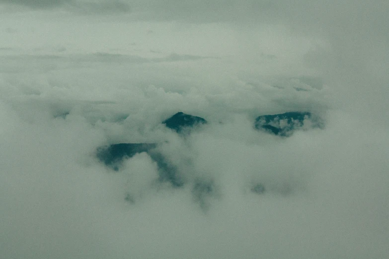 the top of the view of a person's shoes and clouds