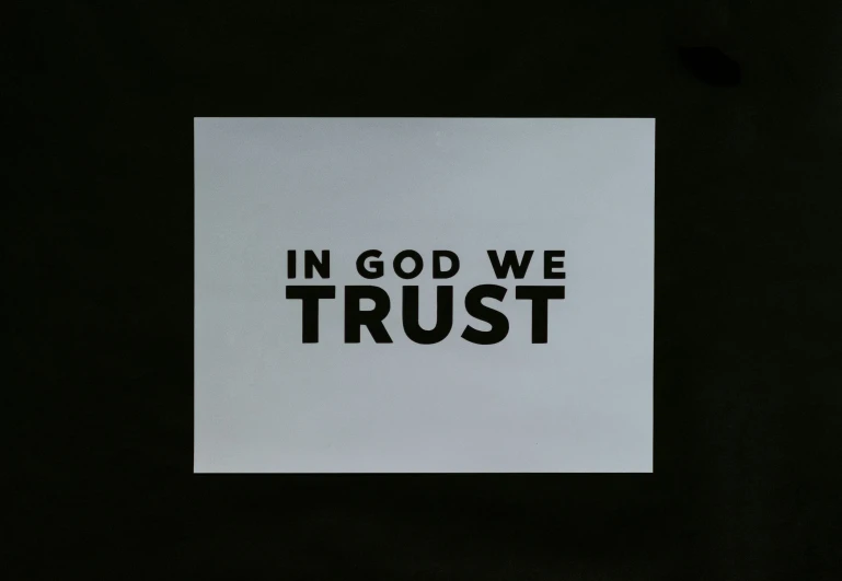 a piece of paper that says in god we trust