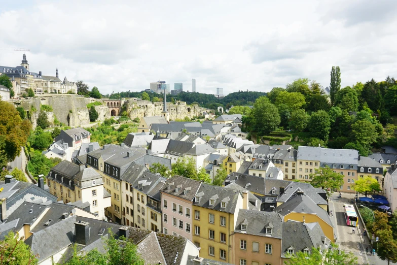 a view of the roofs and towers of buildings in the middle of a city