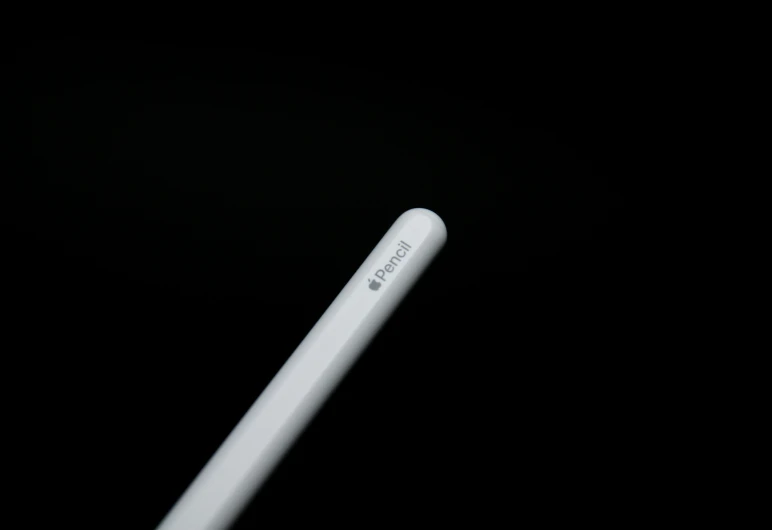 a close up of the back end of a white toothbrush