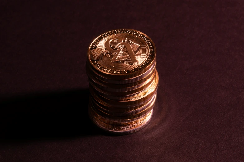 some coins are stacked high on the table