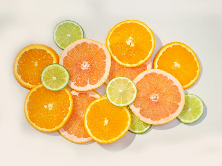 various citrus fruit slices are stacked together