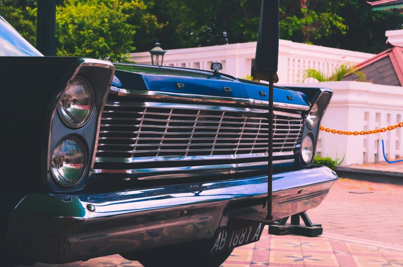 the front end of an old style car