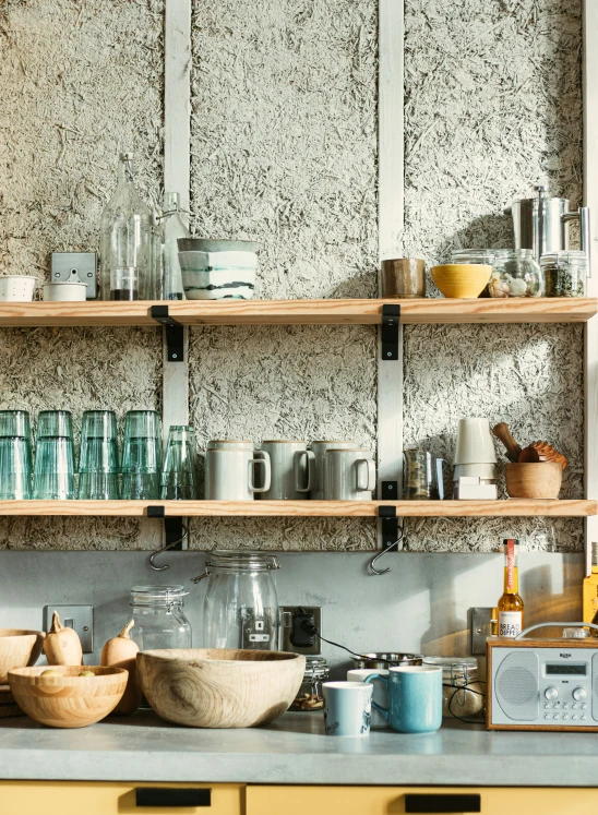 a kitchen counter is filled with dishes, pots and pans