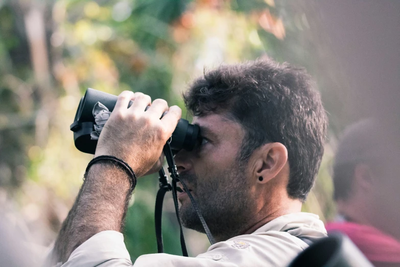 man with camera taking picture in open area