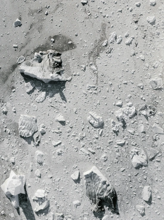 some rocks and rock formations and water on the ground