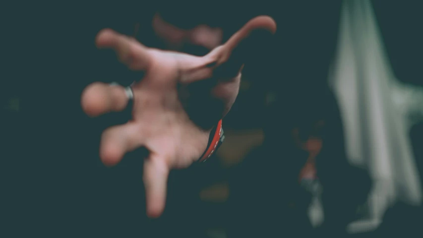 an hand with some fingers out of focus