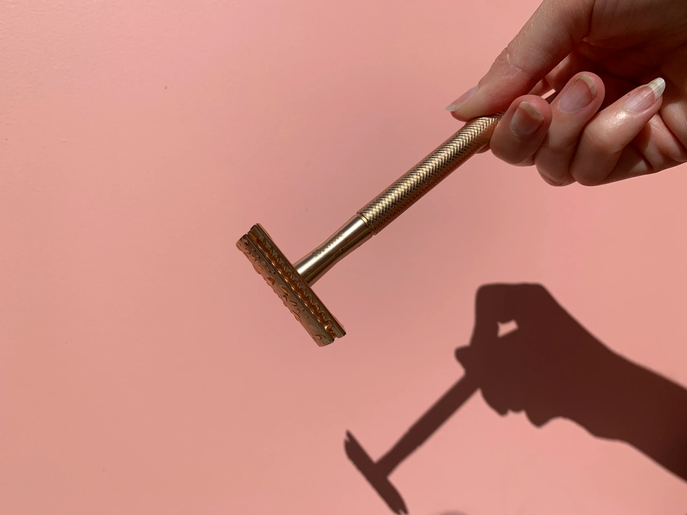 a person holding up a large metal piece