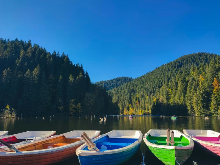 a couple of boats are parked in the water