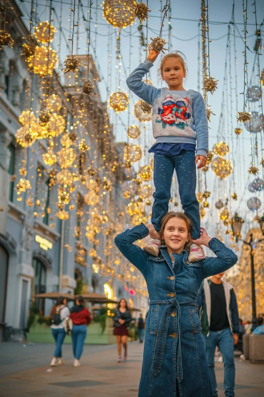 two s stand on their heads as they pose for the camera