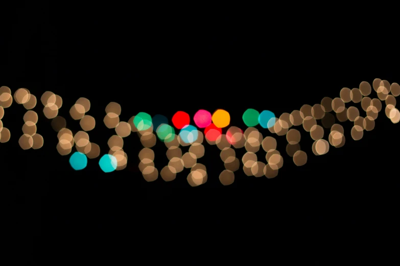 colorful circles and lights on a dark background