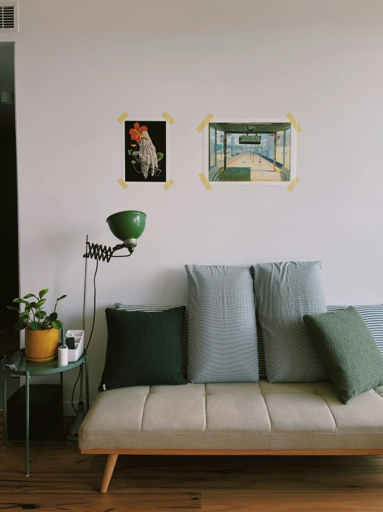 a sofa and table in front of the wall