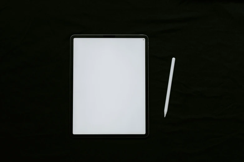 a white cardboard board next to a toothbrush