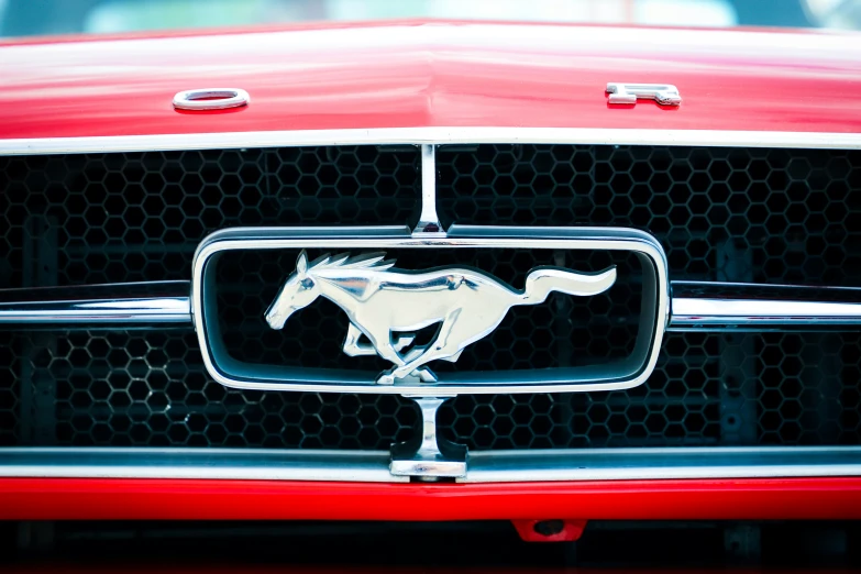 the emblem on a red mustang is shown