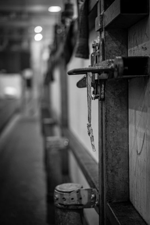 the doorway at the train station has an open latch and a handle