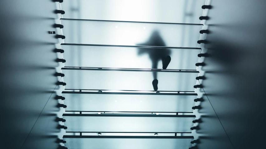 a person on a set of stairs in the light