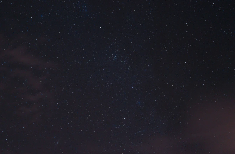 some clouds that are in the air and stars